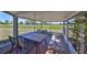 Enjoy outdoor dining on the screened patio, with views of the lush lawn at 607 Fox Hills Dr, Sun City Center, FL 33573