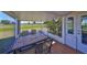 Relax in the screened patio, perfect for enjoying the weather and views of the manicured lawn at 607 Fox Hills Dr, Sun City Center, FL 33573