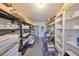 Spacious storage room with built in shelving and plenty of room for organization at 607 Fox Hills Dr, Sun City Center, FL 33573