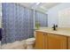 Bathroom featuring a tub with shower curtain, toilet and single vanity at 6109 Kingbird Manor Dr, Lithia, FL 33547