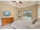 Bedroom featuring ceiling fan and direct access to the screened pool and outdoor living area at 6109 Kingbird Manor Dr, Lithia, FL 33547