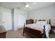 Bedroom features neutral walls, carpet and furniture with a ceiling fan at 6109 Kingbird Manor Dr, Lithia, FL 33547