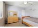 Bedroom featuring a dresser, ceiling fan and window with natural light at 6109 Kingbird Manor Dr, Lithia, FL 33547