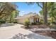 Charming home with a brick-accented facade, three car garage, and well-maintained landscaping at 6109 Kingbird Manor Dr, Lithia, FL 33547