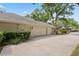 Spacious three-car garage with long driveway and manicured landscaping at 6109 Kingbird Manor Dr, Lithia, FL 33547