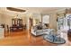 Elegant living room featuring hardwood floors, a dining area, and seamless access to a screened-in patio at 6109 Kingbird Manor Dr, Lithia, FL 33547
