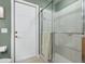 Shower in the neutral bathroom features white tile and a glass enclosure at 6109 Kingbird Manor Dr, Lithia, FL 33547