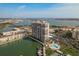 High-rise condo building with a swimming pool and boat docks by the bay at 7300 Sun Island S Dr # 202, South Pasadena, FL 33707