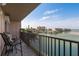 Balcony overlooking picturesque waterfront views with seating area at 7300 Sun Island S Dr # 202, South Pasadena, FL 33707