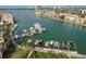 Aerial view of community boat slips, with a variety of boats docked, and direct access to the bay at 7300 Sun Island S Dr # 202, South Pasadena, FL 33707