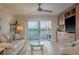 Cozy living room with balcony access and serene water views for relaxation and enjoyment at 7300 Sun Island S Dr # 202, South Pasadena, FL 33707