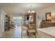 Open living area with views of the water, comfortable seating, and a dining area at 7300 Sun Island S Dr # 202, South Pasadena, FL 33707