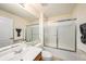 The bathroom features a walk-in shower and single vanity, complete with a large mirror at 7924 Carriage Pointe Dr, Gibsonton, FL 33534