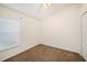 Small bedroom with carpet, a window letting in natural light, and a closet for storage at 7924 Carriage Pointe Dr, Gibsonton, FL 33534