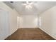 Spacious bedroom with neutral walls and a ceiling fan providing a comfortable atmosphere at 7924 Carriage Pointe Dr, Gibsonton, FL 33534