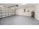 Spacious garage with epoxy flooring and water heater at 7924 Carriage Pointe Dr, Gibsonton, FL 33534