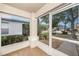 This is a view of the front porch with brick flooring and a view of the front yard at 7924 Carriage Pointe Dr, Gibsonton, FL 33534