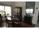 Elegant dining room with hardwood floors, a large mirror, and classic furnishings at 8609 Thimbleberry Ln, Tampa, FL 33635