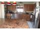 Kitchen with granite countertop, stainless steel appliances, and a breakfast bar with seating at 8609 Thimbleberry Ln, Tampa, FL 33635