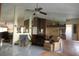 Open living room with tile flooring, a decorative fireplace, and a mirrored wall feature at 8609 Thimbleberry Ln, Tampa, FL 33635