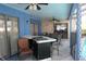 Outdoor patio area with ceiling fans, a custom bar setup, and comfortable seating at 8609 Thimbleberry Ln, Tampa, FL 33635