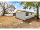 A spacious backyard featuring a well-kept lawn and a screened-in patio, perfect for outdoor entertaining at 9216 Mark Twain Ln, Port Richey, FL 34668