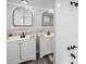 Modern bathroom featuring double vanity sinks, modern black fixtures, and a separate shower at 9216 Mark Twain Ln, Port Richey, FL 34668