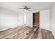 Bedroom with stylish floors, fan, closet and neutral paint at 9216 Mark Twain Ln, Port Richey, FL 34668
