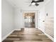 Bright bedroom featuring luxury flooring and sliding glass doors leading to a screened patio at 9216 Mark Twain Ln, Port Richey, FL 34668
