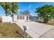 Charming single-story home with a well-manicured lawn and a long, private driveway at 9216 Mark Twain Ln, Port Richey, FL 34668