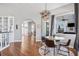 Cozy breakfast nook featuring hardwood floors, modern lighting, and a breakfast table with seating for four at 1002 Romano Ne Ct, St Petersburg, FL 33702
