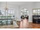 Elegant dining room showcases stylish chandelier, plantation shutters, and access to the living area at 1002 Romano Ne Ct, St Petersburg, FL 33702