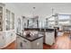 Well-designed kitchen features granite countertops, an island, and open access to the living area at 1002 Romano Ne Ct, St Petersburg, FL 33702