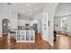 Modern kitchen features white cabinetry, stainless steel appliances, and a functional center island at 1002 Romano Ne Ct, St Petersburg, FL 33702