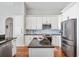 Beautiful kitchen with granite counters, stainless steel appliances, and ample cabinet space at 1002 Romano Ne Ct, St Petersburg, FL 33702