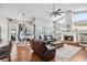 Bright, open living area with a fireplace, hardwood floors, and seamless integration with the kitchen at 1002 Romano Ne Ct, St Petersburg, FL 33702