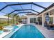 Beautiful pool area with a tiled deck, spa, lounge chairs, and a screened enclosure for year-round enjoyment at 1002 Romano Ne Ct, St Petersburg, FL 33702