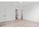 Spacious bedroom featuring hardwood flooring and an en-suite bathroom entrance at 109 Punta Vista Dr, St Pete Beach, FL 33706