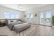 Bedroom boasting balcony access and serene water views at 109 Punta Vista Dr, St Pete Beach, FL 33706