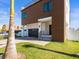 Modern two-story home featuring a balcony, a paved driveway, and verdant lawn at 109 Punta Vista Dr, St Pete Beach, FL 33706