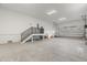 Spacious garage area with staircase and plenty of storage space at 109 Punta Vista Dr, St Pete Beach, FL 33706