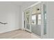 Bright, spacious patio with sliding glass doors overlooking the pool and waterfront view at 109 Punta Vista Dr, St Pete Beach, FL 33706