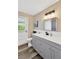 Bathroom boasts stylish vanity with modern fixtures, white countertops, and attractive light fixture at 11361 88Th Ave, Seminole, FL 33772