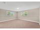 Spacious bedroom with neutral paint, carpet floors, and dual windows for natural light at 11361 88Th Ave, Seminole, FL 33772