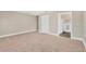 A cozy bedroom with neutral-toned walls, soft carpeting, and an en-suite bathroom at 11361 88Th Ave, Seminole, FL 33772