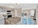 Open concept kitchen with stainless steel appliances, a dining area, and lots of sunlight at 11361 88Th Ave, Seminole, FL 33772