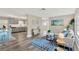 Open-concept living area connects the kitchen, dining and living spaces, promoting a seamless flow at 11361 88Th Ave, Seminole, FL 33772
