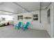 A cozy patio seating area perfect for relaxing outdoors with two blue chairs at 11361 88Th Ave, Seminole, FL 33772
