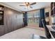 A bedroom with built-in shelving and a closed murphy bed at 11602 Crowned Sparrow Ln, Tampa, FL 33626