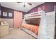 A bedroom with a bunk bed and storage at 11602 Crowned Sparrow Ln, Tampa, FL 33626